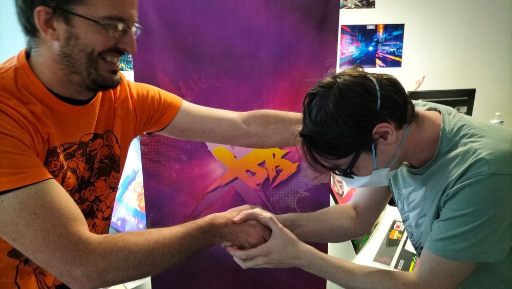 Zorg having his head low, shaking the hand of Grumot after the FT3.