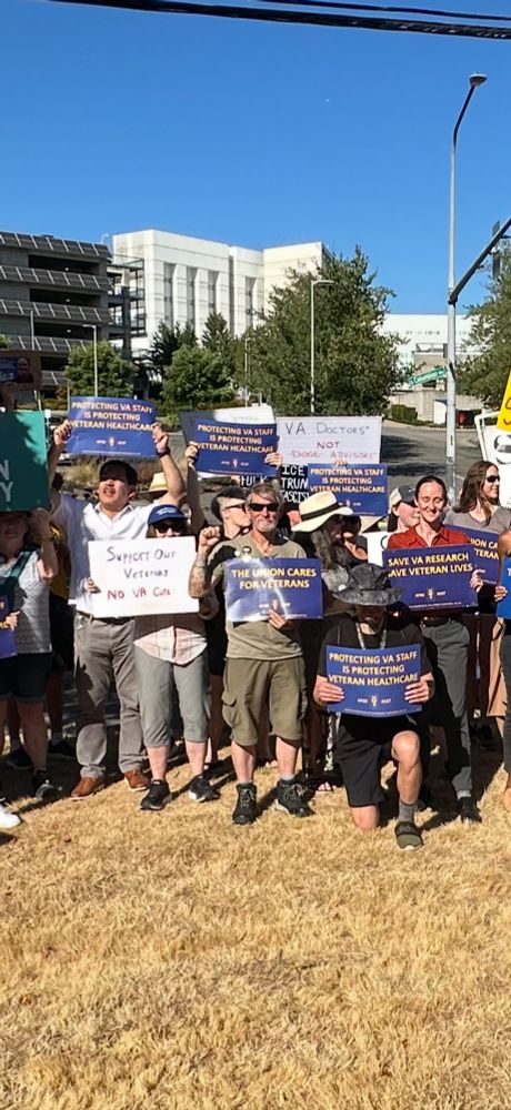 Katie standing with VA workers!