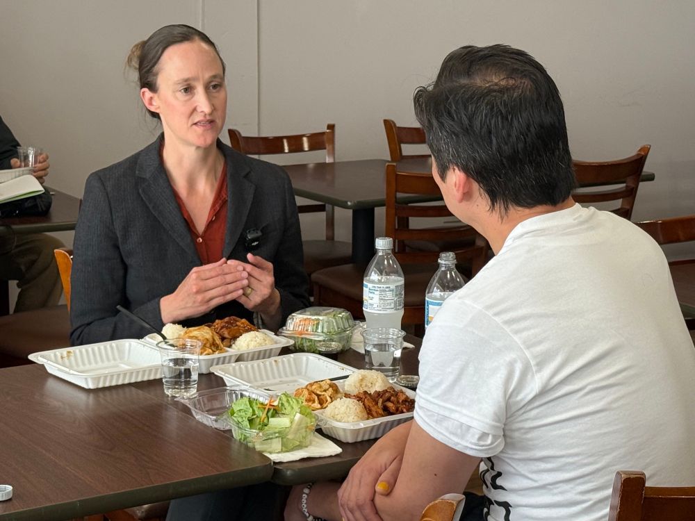 Katie and Kenji have a conversation over teriyaki