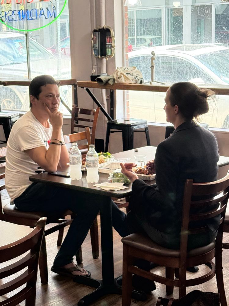 Kenji and Katie having a conversation over teriyaki.