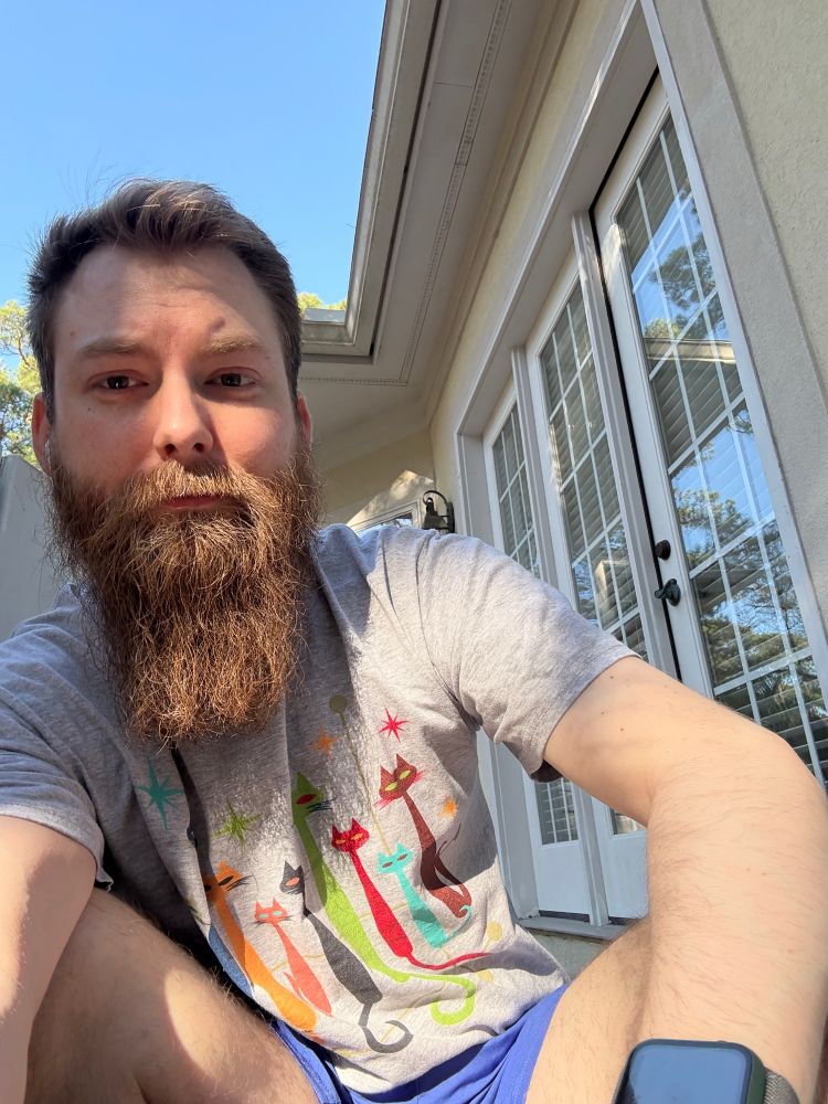 sun shining on me wearing a cat shirt. 