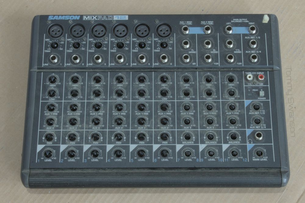 the mixer with all the knobs removed, the front panel is covered with dirt