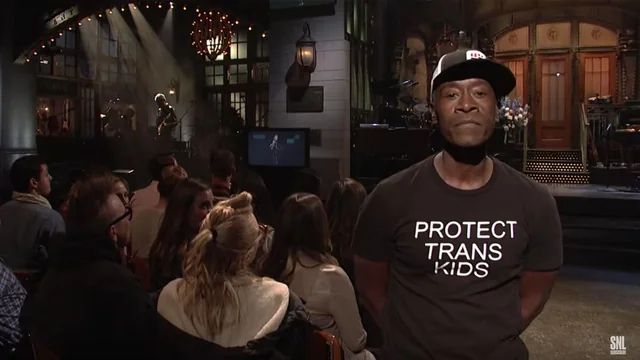 don cheadle on snl wearing a shirt that says protect trans kids
