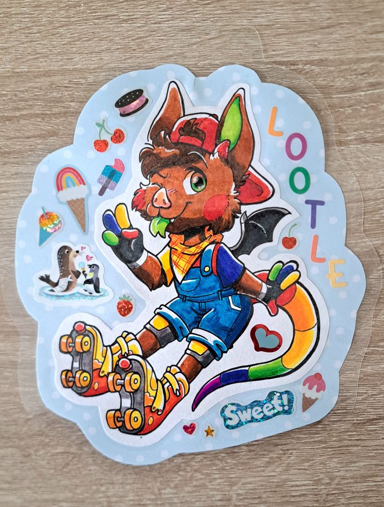 A marker badge art of a brown bat with a rainbow striped possum tail wearing roller skates, overalls and a backwards baseball cap. He is holding up one hand in a peace sign and sticking out his tongue. There are ice cream themed stickers surrounding him and letters spelling out the name LOOTLE.