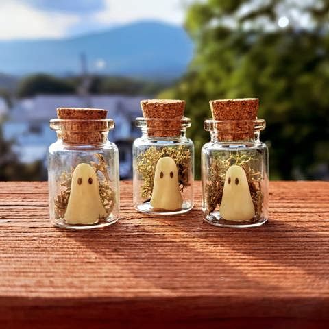 Handmade bottled ghost charms.