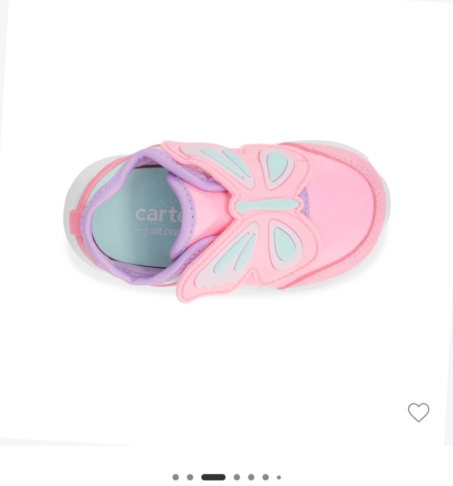 Screenshot of a baby shoe. The shoe is pink with a big butterfly strap.