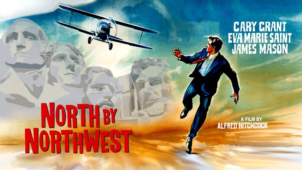 Movie poster for 'North by Northwest', depicting Cary Grant being chased by a crop-dusting biplane with the desecrated Black Hills in the background.