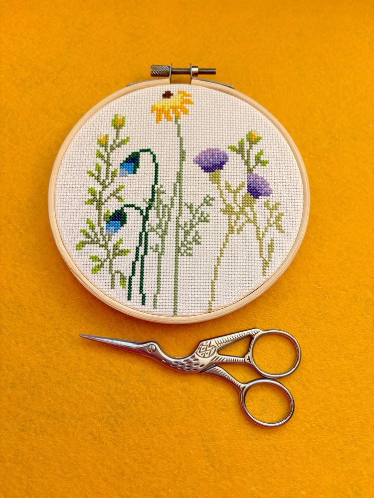 Finished cross stitch in 5 inch wooden hoop with wildflowers design