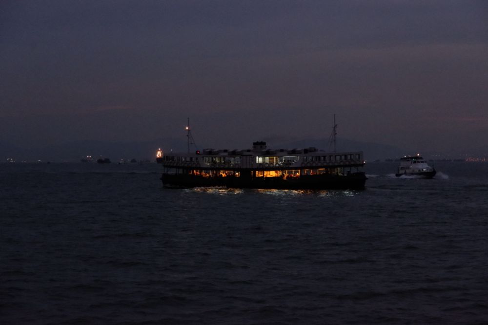 HongKong ferry at dusk crossing. Handheld photography.