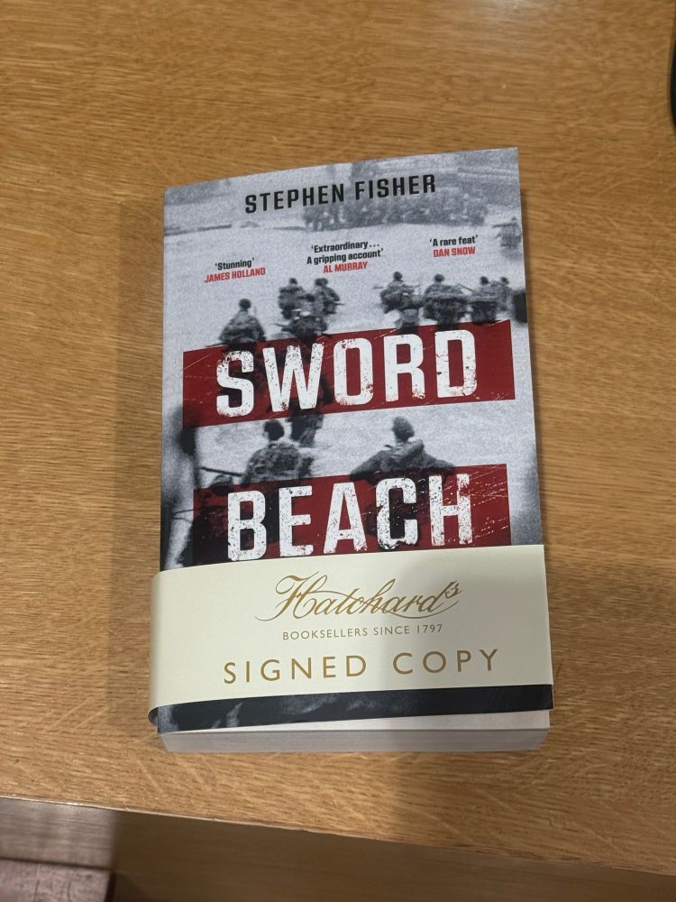 A copy of my book, Sword Beach by Stephen Fisher, with an obi sleeve noting it is a signed copy 
