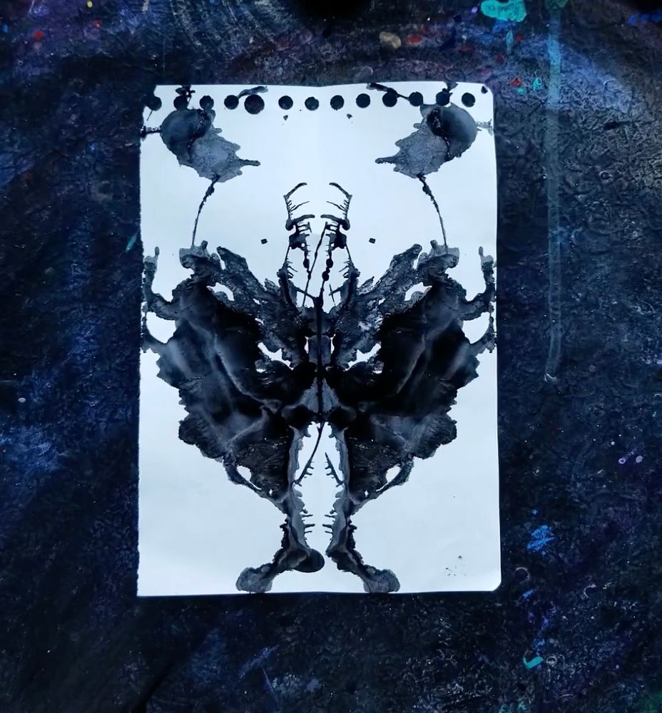 black ink strewn across white paper. the image formed can be many things ... or nothing at all 