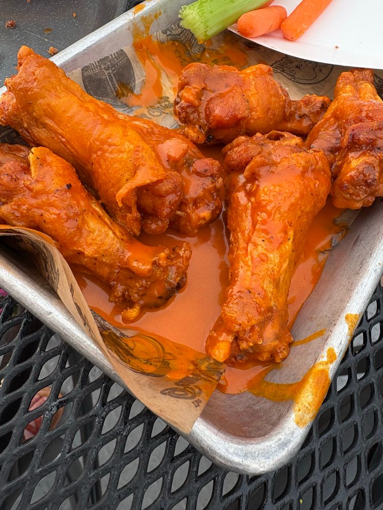a plate of buffalo sauced wings