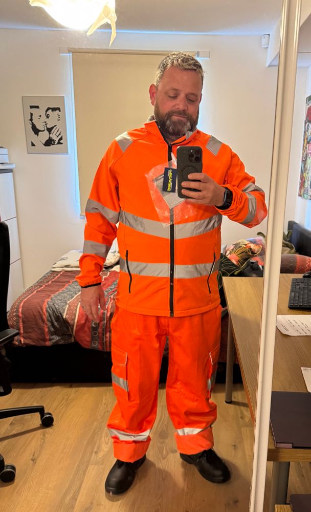New high vis work clothes is fluorescent orange