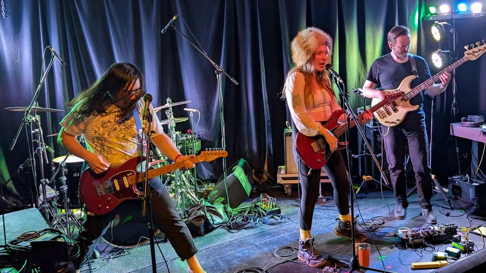 Skye Wallace (and their band) on stage at Red Gate for JunoFest 