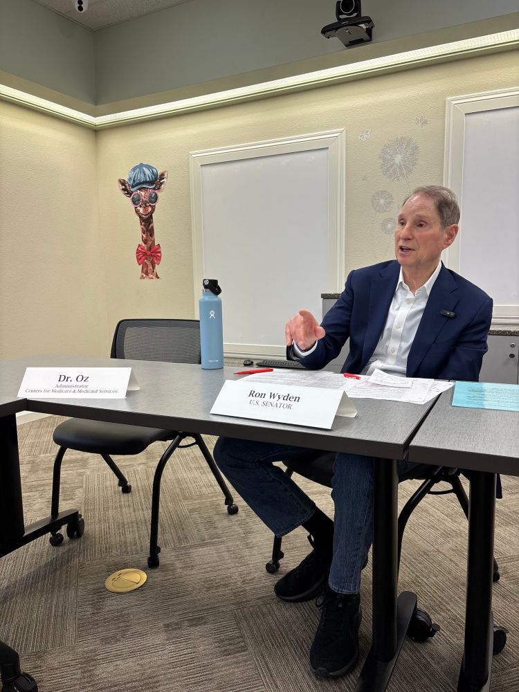 A photo of me at a Medicaid roundtable in Malheur County. Next to me is an empty chair where Dr. Oz is supposed to be seated.