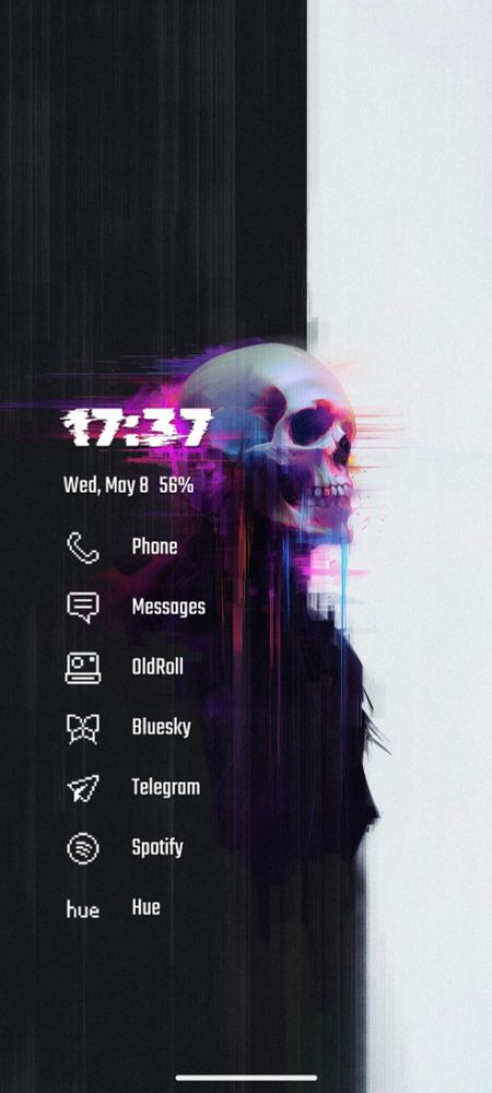 A minimalist phone home screen with a backdrop consisting of two contrasting vertical halves. One dark, one light, with a glitchy magenta tinted skull in the middle.