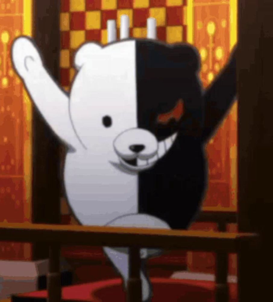 a black and white teddy bear is standing in a room with his arms in the air .