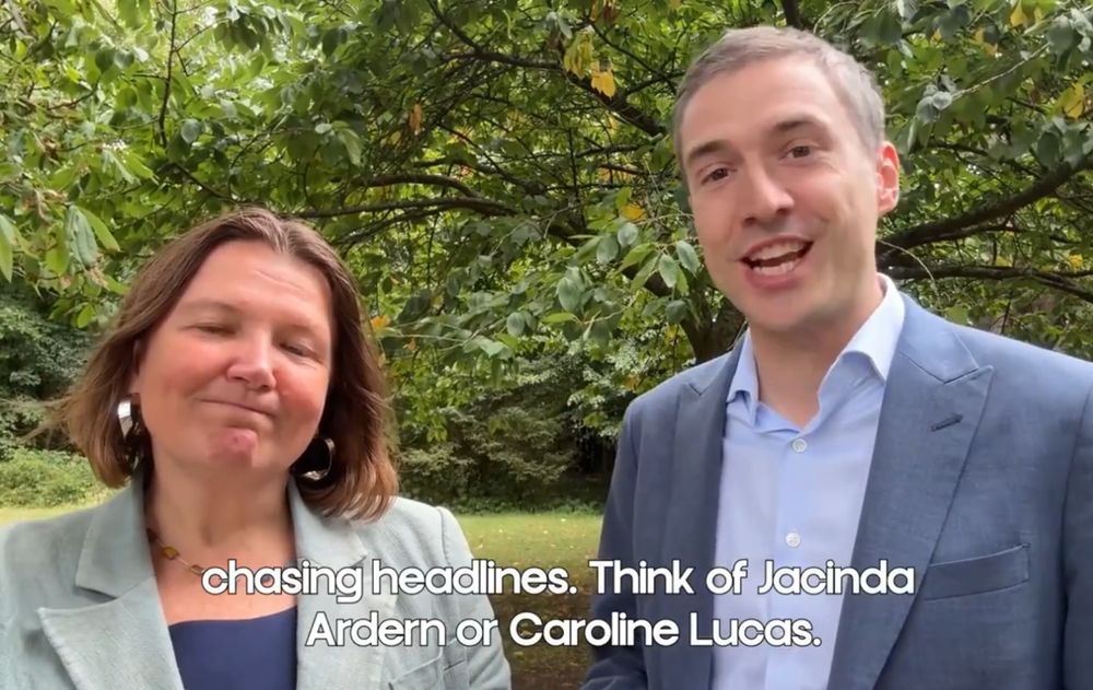 I cannot describe the sheer volume of cringe being depicted in just this one frame of one of this video, an absolute tidal wave of embarrassment. The sheer levels of Partridge being emanated here... umm, it's Ellie Chowns and Adrian Ramsay standing in a garden looking sincere. The subtitle reads "chasing headlines. Think of Jacinda Ardern or Caroline Lucas"