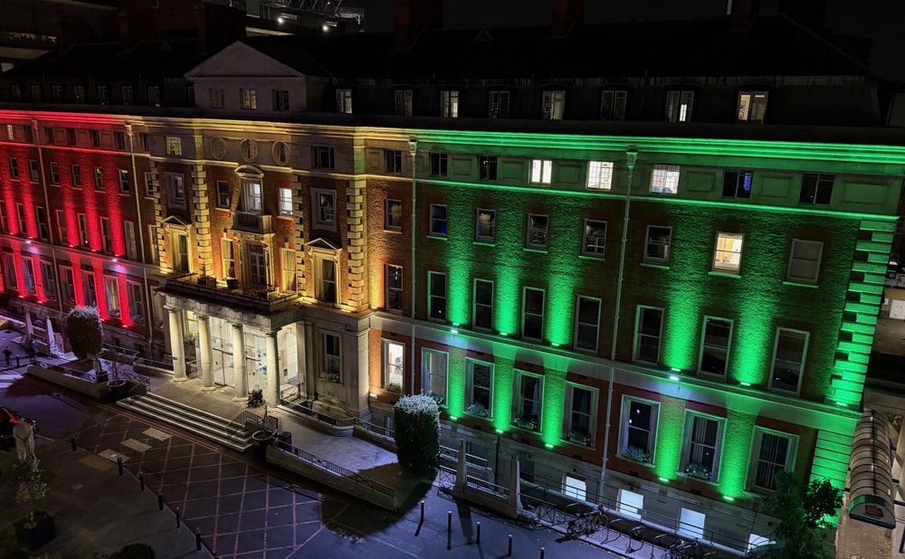 Hambleden Wing at King’s College Hospital lit up in red, yellow, and green.