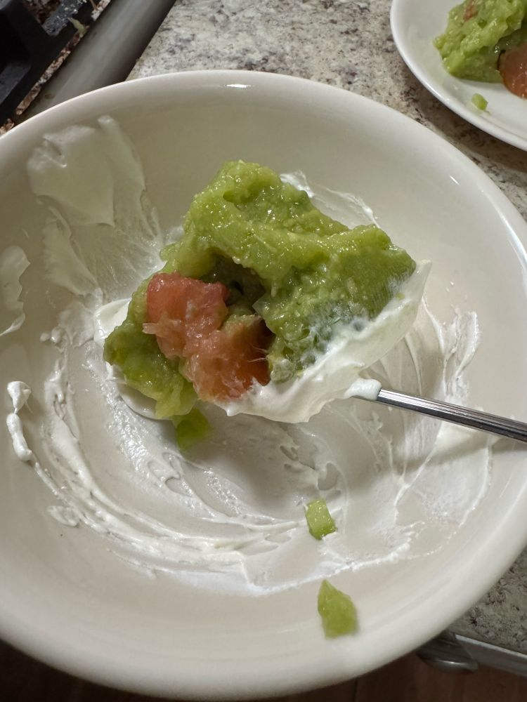 A quarter of the horror in a bowl with a spoon before eating. Grapefruit chunks are more visible in the cross section and the bowl is smeared with more of the whipped cream/mayo mixture because it was the same bowl used to mix it up and wasn’t worth messing up a new one in my opinion. 