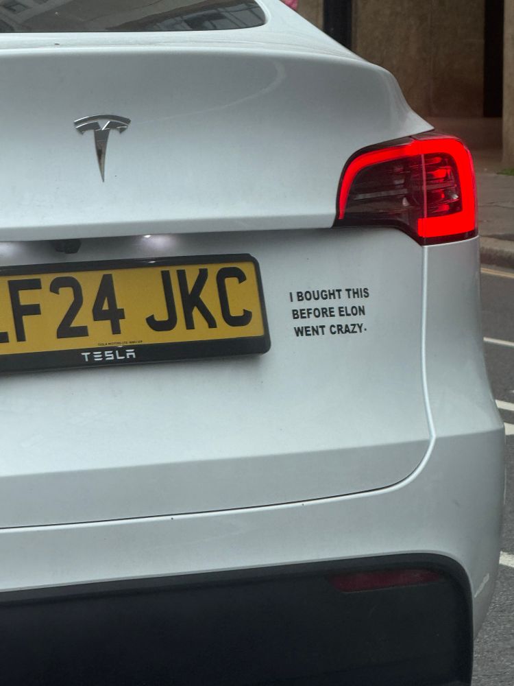 2024 Tesla with “I bought this before Elon went crazy” sticker.