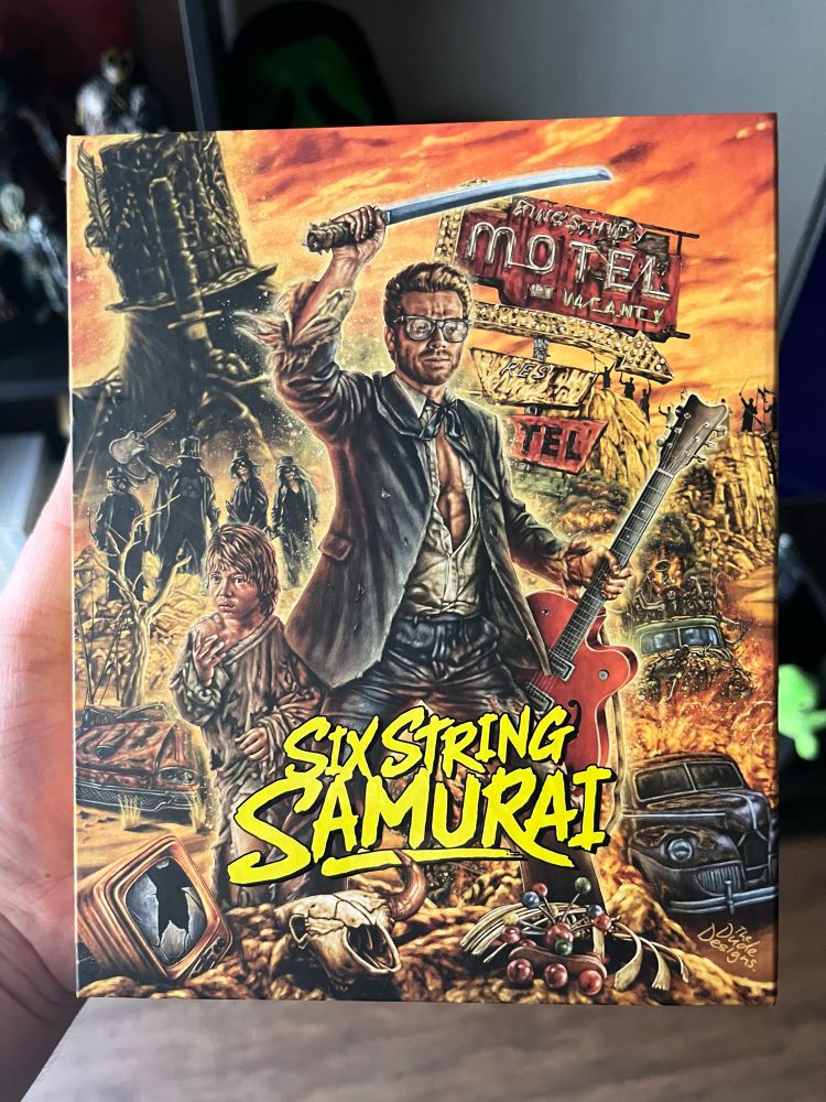 Cover art for the film “Six String Samurai” depicting a man holding a guitar and a samurai sword