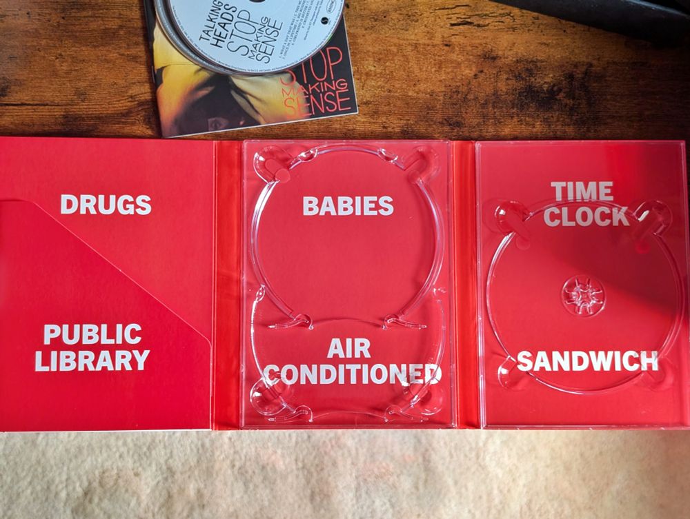 inside of a release of talking heads' stop making sense:

DRUGS         BABIES         TIME CLOCK

PUBLIC LIBRARY   AIR CONDITIONED   SANDWICH