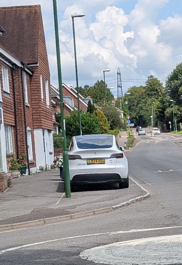 A nazi mobile parked on the pavement like a motherfucking TWAT