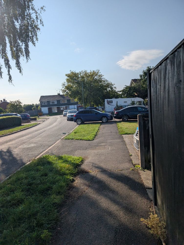 Some fucking shitwit parked perpendicular to - and actually across - the pavement, like a massive bell end. 