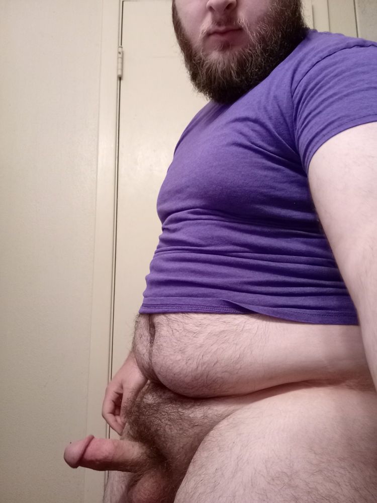 Picture of me half naked in a purple shirt with my dick and balls out.
