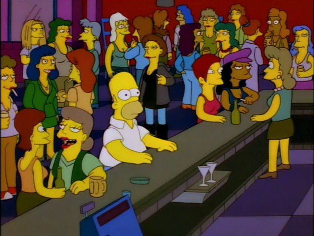 Homer Simpson obliviously sits amidst a group of lesbians at a lesbian bar