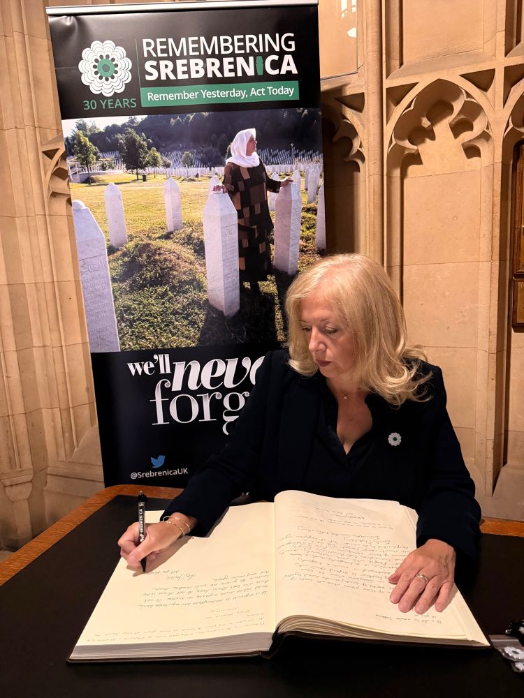 Liz Jarvis MP signing the Book of Remembrance in Westminster for the victims of the Srebrenica genocide 