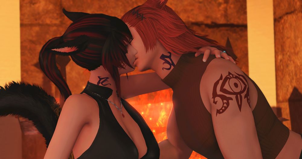 K'yalwenn and G'raha kissing in front of the fireplace. 