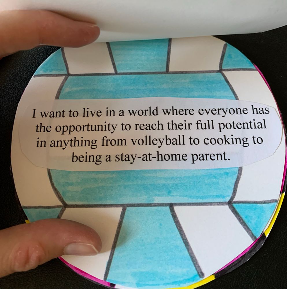A page with a volleyball that is blue and white. the text says "I want to live in a world where everyone has the opportunity to reach their full potential in anything from volleyball to cooking to being a stay-at-home parent."