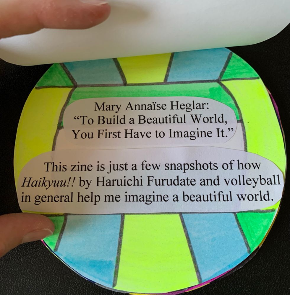 A page with a volleyball that has bright yellow, blue, and green colors. the text says "Mary Annaise Heglar: "To Build a Beautiful World, You First Have to Imagine It." Under that, the text says "This zine is just a few snapshots of how Haikyuu!! by Haruichi Furudate and volleyball in general help me imagine a beautiful world."