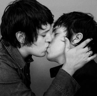 Album cover for Total by SebastiAn, black and white photo of artist kissing a clone of himself