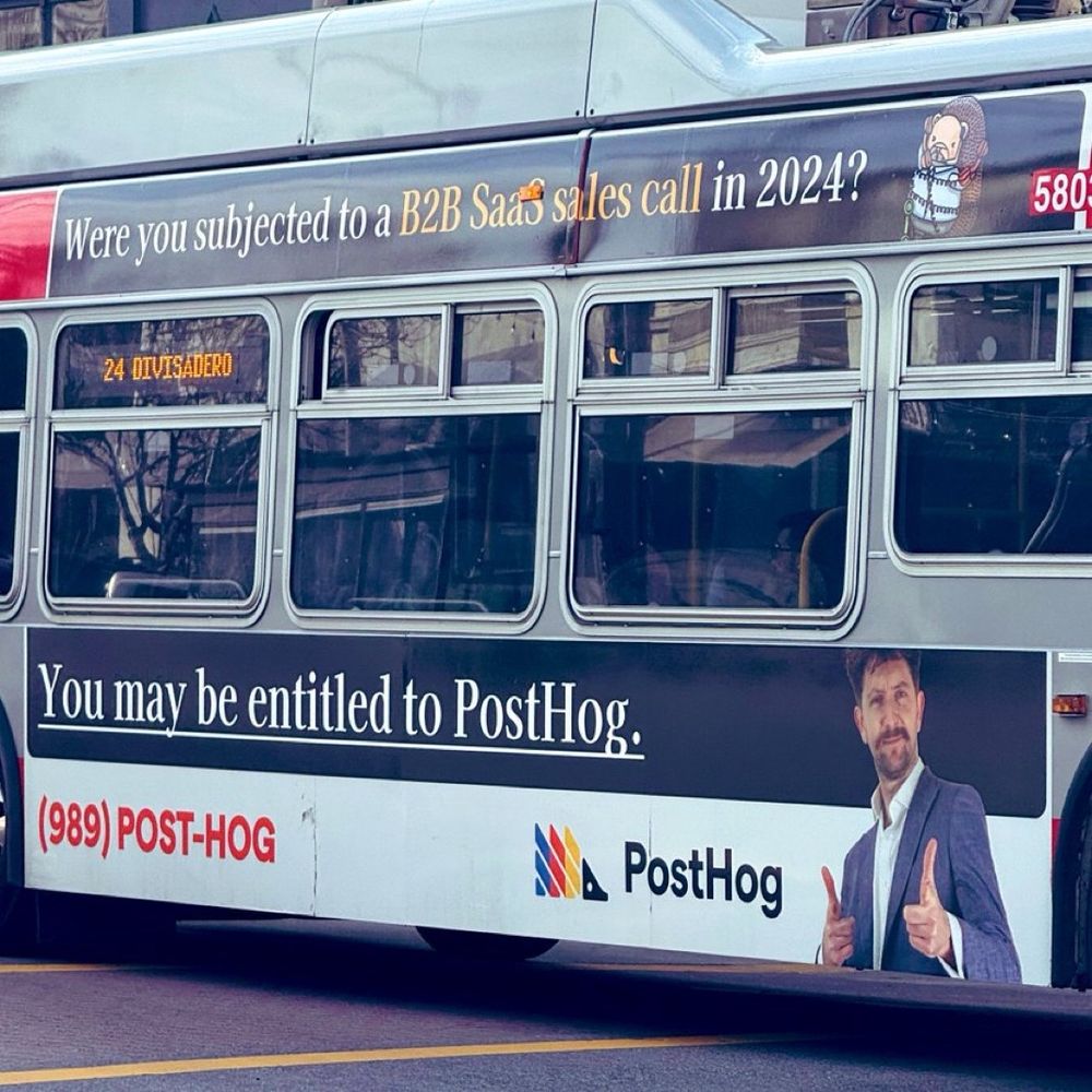 bus that says 
“You may be entitled to PostHog:
(989) POST-HOG
a PostHog”
on the side 