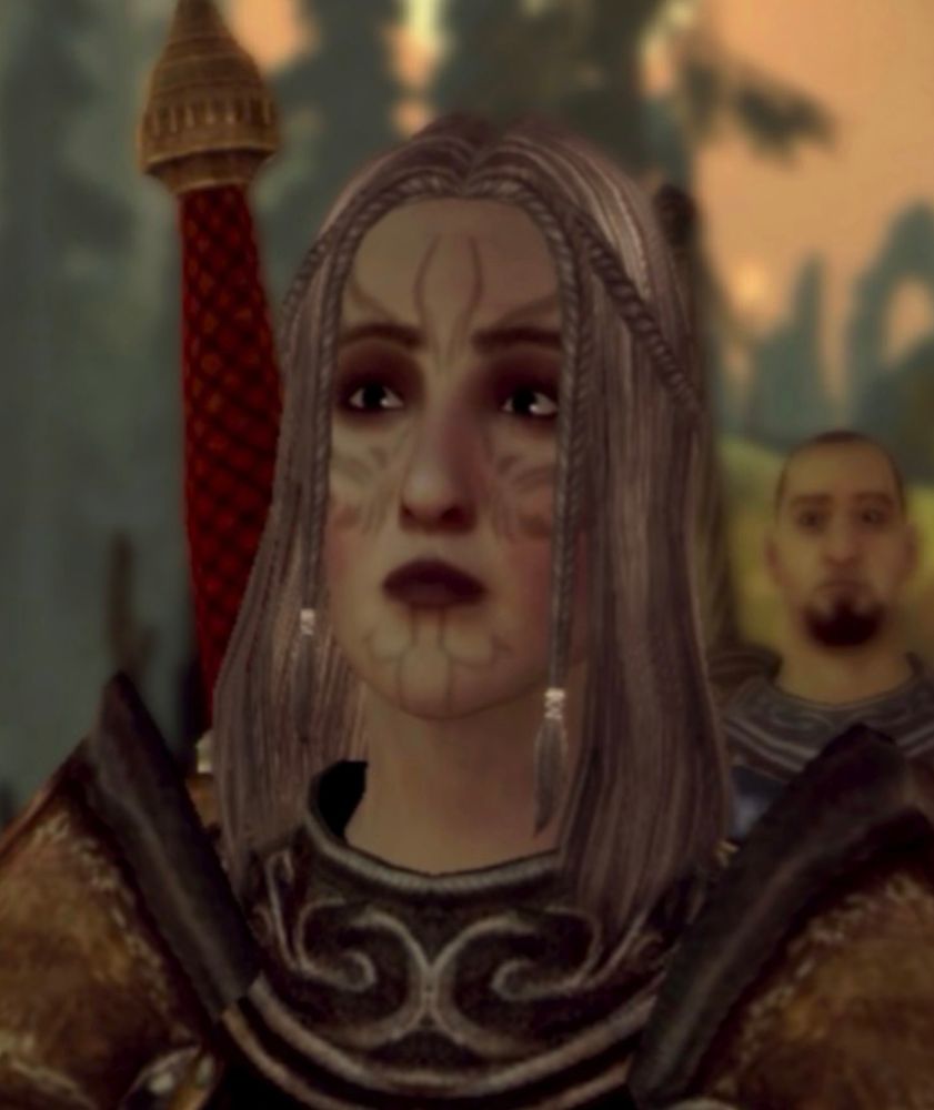 A portrait screenshot from Dragon Age: Origins of the same city elf, wearing basic armor. 