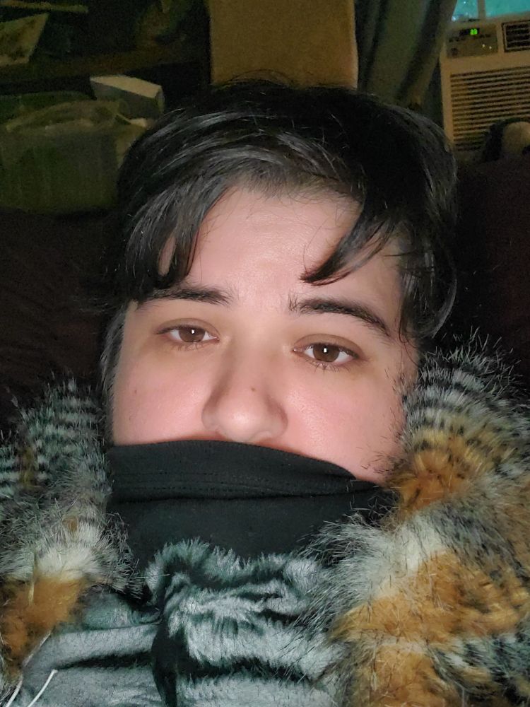 Selfie with owl feathers around shoulders