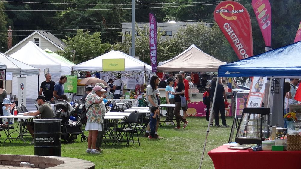 Lots of people and booths promoting goods, services and freshly cooked South American foods! 