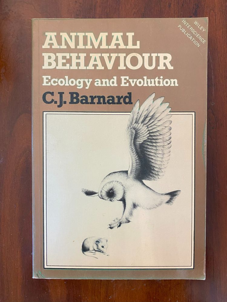 Barn Owl about to silently rescue a mouse from danger, cover of: Animal Behaviour, by C. J. Barnard