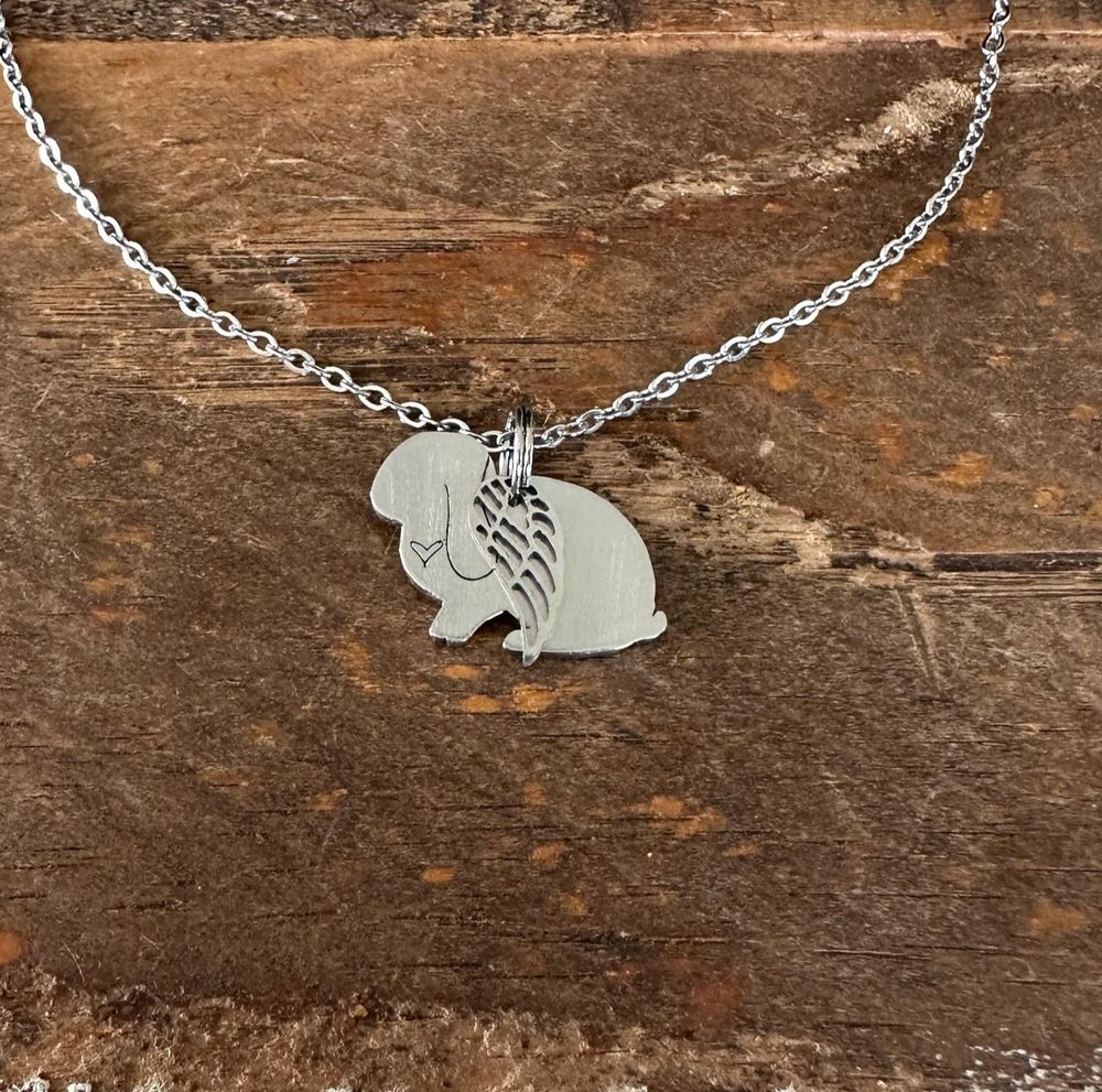 Stainless steel lop eared rabbit necklace with stamped heart and wing charm
