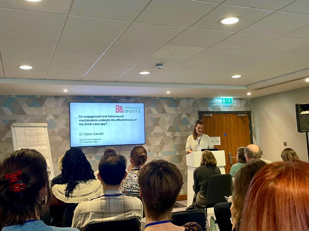 Conference room where Claire Garnett is presenting on “do engagement and behavioural characteristics underpin the effectiveness of the Drink Less app”