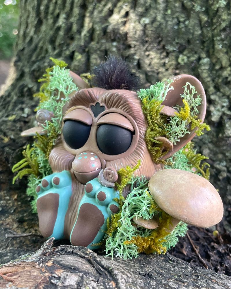 the same forest furby but from a slight angle 