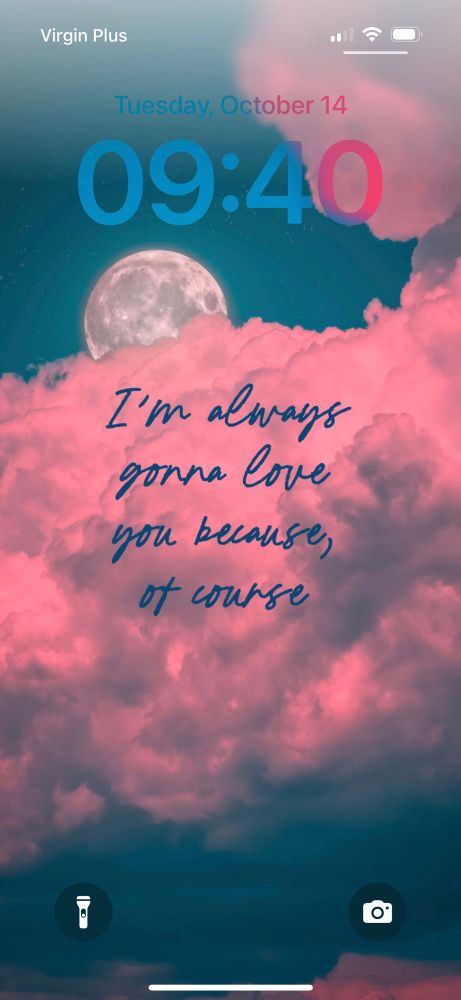 Lock Screen. Date and time, and then the moon behind pink clouds with “I’m always gonna love you because, of course” in blue cursive 