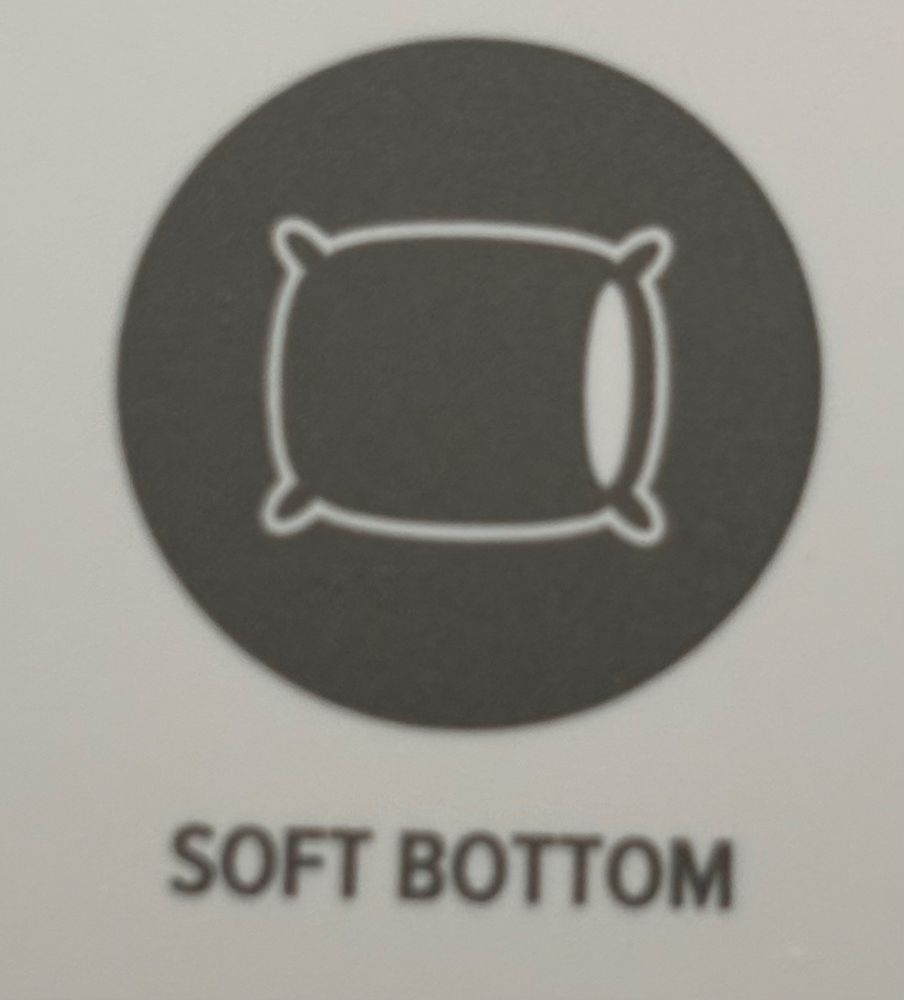a label with a picture of a stylized pillow with text below it that reads “soft bottom”