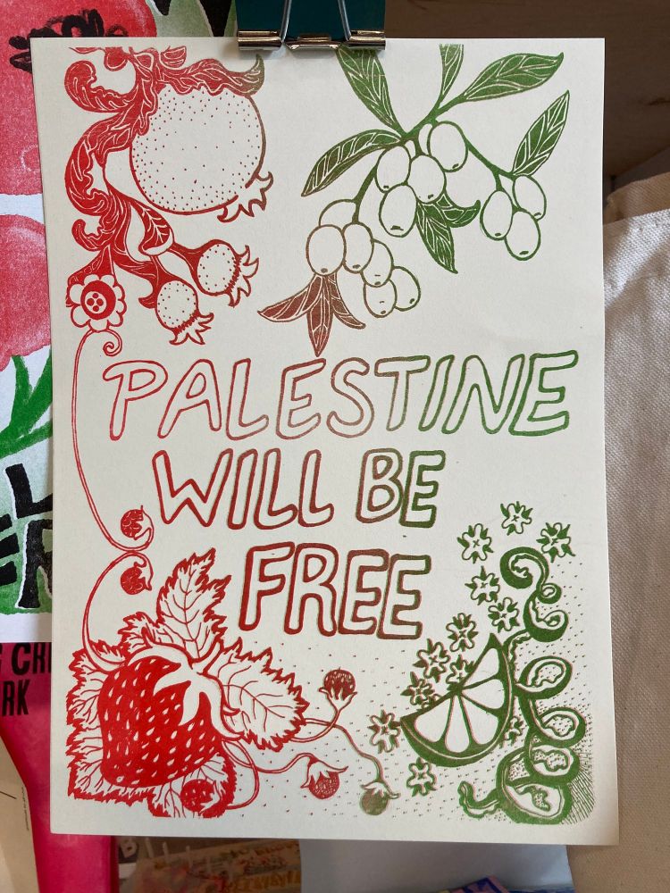 image of a red and green risograph print with the text "Palestine will be free" surrounded by illustrated fruits- strawberries, pomegranates, olives, and a citrus 
