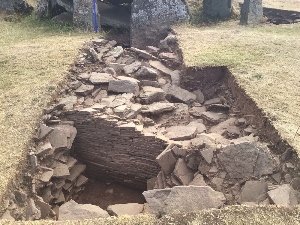 Colour image of the excavation of the tomb revealing a finely made revetments.