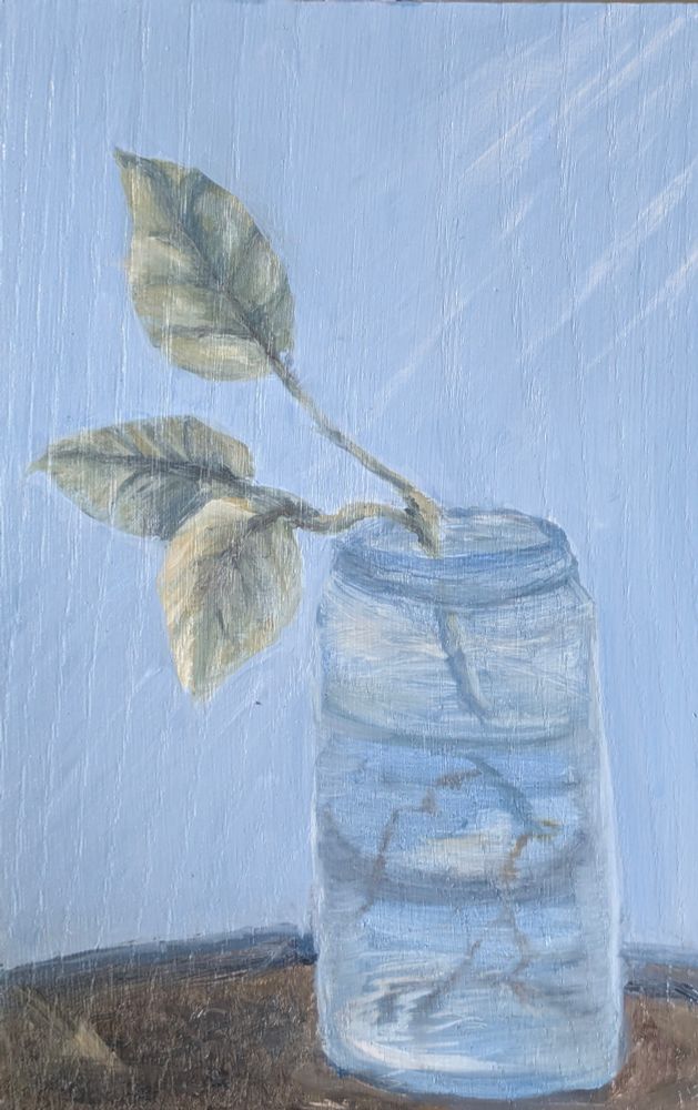 A realistic oil painting depicts a glass jar of water sitting on a dark surface against a soft, light blue-gray background. Three green leaves that join to form a single stem, a cutting, emerge from the jar, their forms slightly drooping. 

The jar is rendered with transparent and reflective qualities, showing subtle highlights and distortions from the water inside. The leaves display gentle shading and vein details, while the entire composition is calm and minimalistic, with visible brushstrokes and a soft, diffused light.