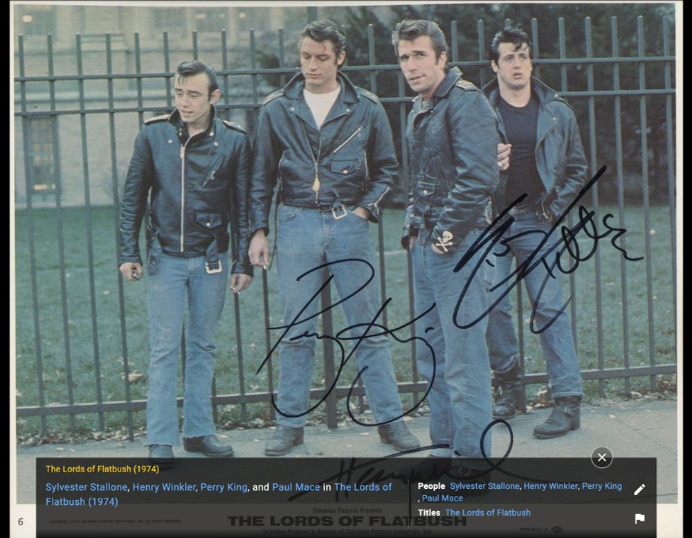 Autographed photo of the four stars of Lords of Flatbush all wearing black leather jackets, blue jeans, and motorcycle boots. Paul Mace, Perry King, Henry Winkler, and Sylvester Stallone.